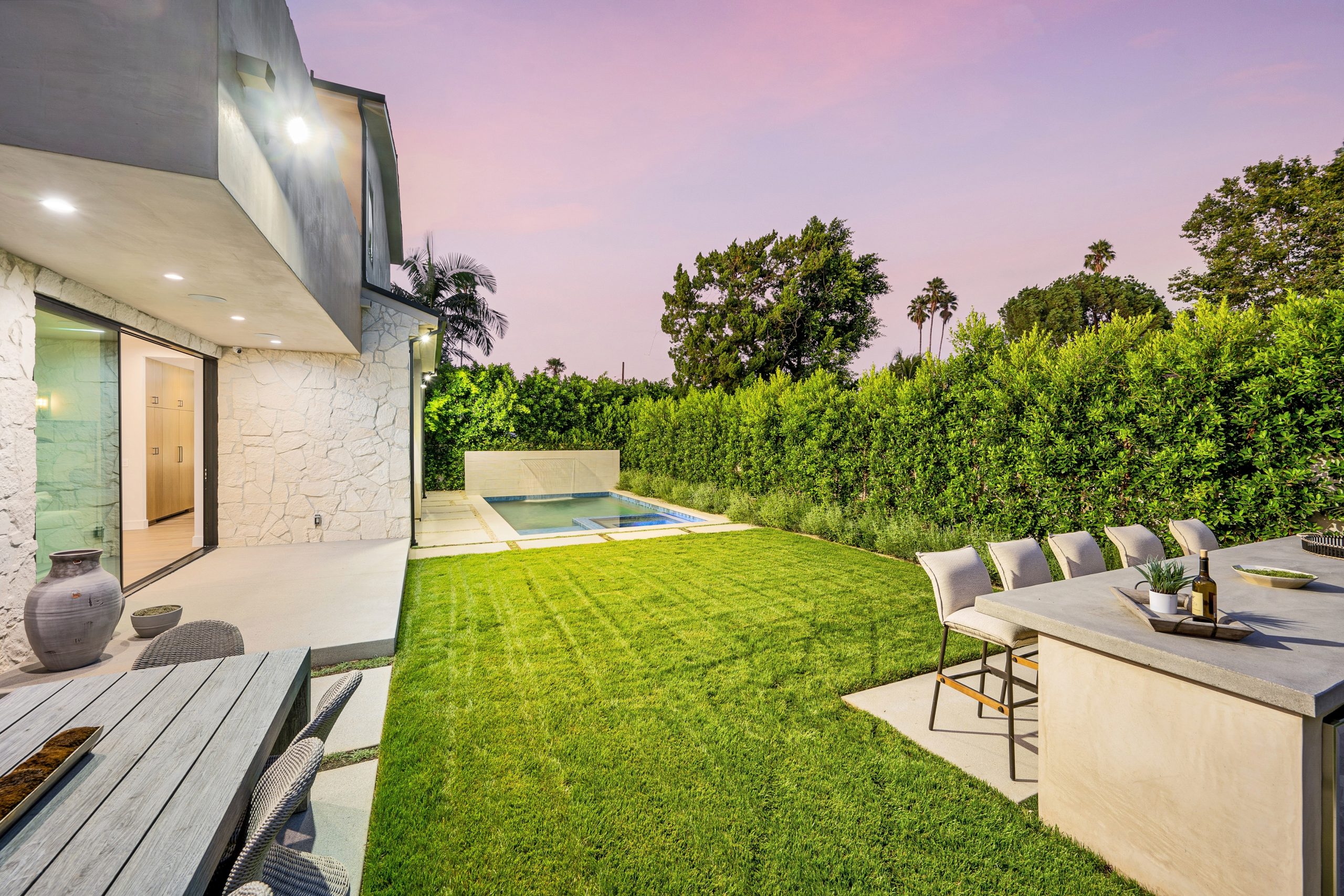 A,Garden,With,Lush,Green,Grass,And,A,Pool,In